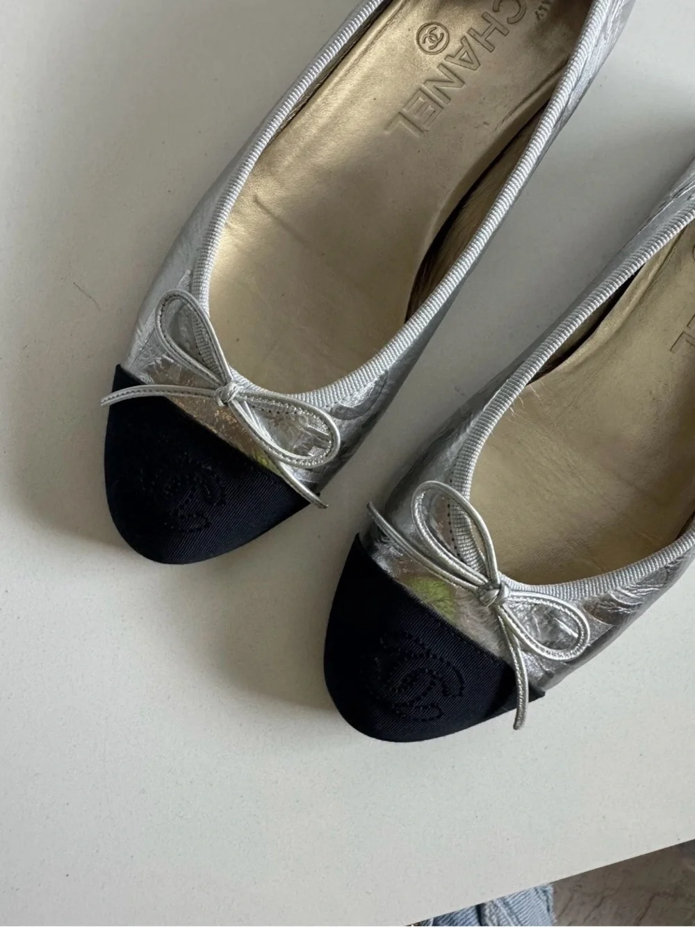 CHANEL Silver Leather Ballerina Flats with Black Cap Toe